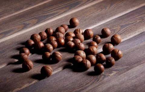 Nuts on a wooden table Stock Photos