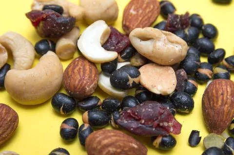 Nuts on yellow background Stock Photos