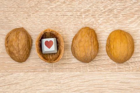 Nutshell with a keyboard key with a heart symbol Stock Photos