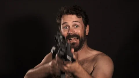 Nutty Guy Loves His Machine Gun Video stock 116999674