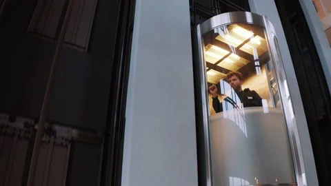 Nutty professor, Man standing in elevator, scribbling scientific formulas 動画素材 139599631