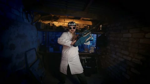 Nutty scientist records a chainsaw experiment in an old garage. Stock Footage 141257539