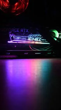 NVidia GeForce RTX 3080 inside gaming PC tower with purple pink backlights in Foto stock