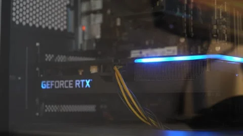 Nvidia GeForce RTX graphics card installed inside desktop computer case with Stock Footage 314875247