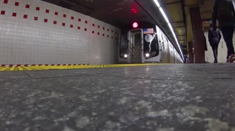 NY subway train departs Penn Station Stock Footage