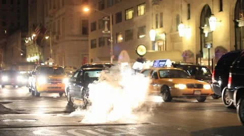 NYC Cab Drives Through Pothole Smoke Stock Footage 10579185