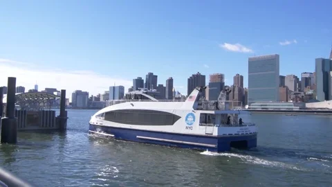 NYC Ferry Docking on River Next to Manhattan Video stock 82764362