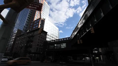 NYC HIGHLINE LOOK UP CLOUDS-FAST MO Stock Footage 973979