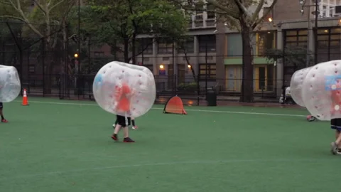 NYC, Human bubble ball, Zorbing. Midtown Manhattan. Westside bubble ball soccer Stock Footage 220620598