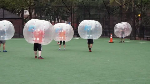 NYC, Human bubble ball, Zorbing. Midtown Manhattan. Westside bubble ball soccer Stock Footage 220620772