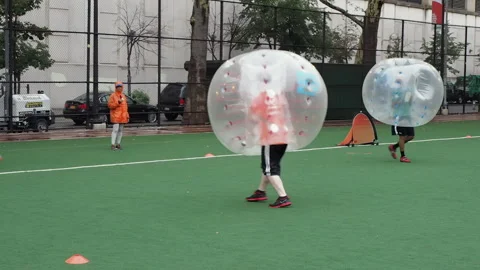 NYC, Human bubble ball, Zorbing. Midtown Manhattan. Westside bubble ball soccer Stock Footage 220620804