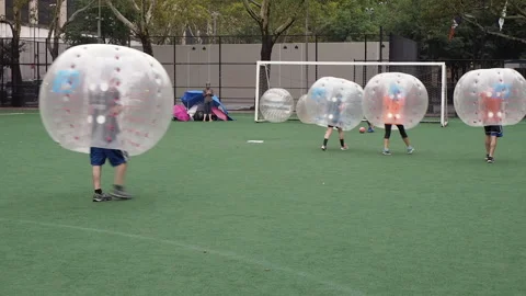 NYC, Human bubble ball, Zorbing. Midtown Manhattan. Westside bubble ball soccer Stock Footage 220620807