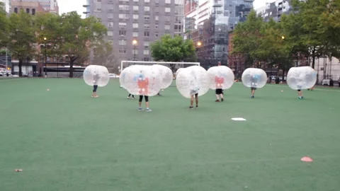 NYC, Human bubble ball, Zorbing. Midtown Manhattan. Westside bubble ball soccer  Stock Footage 220620946