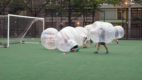 NYC, Human bubble ball, Zorbing. Midtown Manhattan. Westside bubble ball soccer Stock Footage 220620960