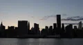 NYC Manhattan Silhouette skyline at Sunset, Skyscrapers, East River, New York HD Footage