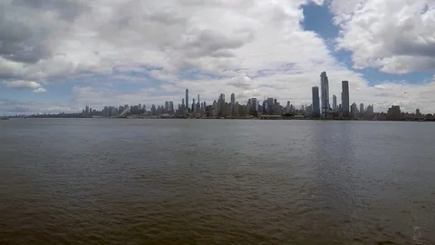 NYC MANHATTAN SKYLINE FROM HUDSON RIVER, PARTIALLY CLOUDY DAY Stock Footage 111281663