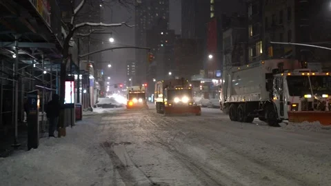 NYC Nor'easter - Sanitation Trucks Plowing in the Storm Stock Footage