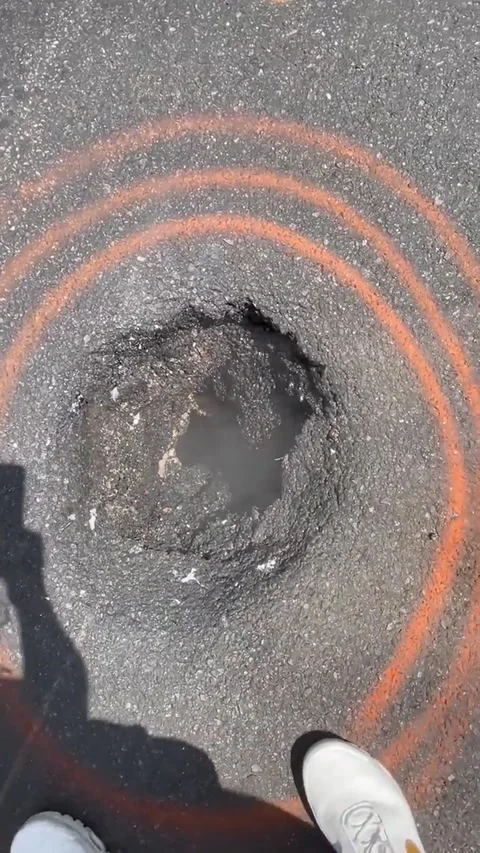 NYC Pothole Emits Steam Like a volcano, New York City, New York, USA - 02 Aug 20 Stock Footage 314404751