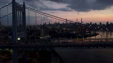 NYC Skyline at Twilight, Long Tracking Shot of Triboro RFK Bridge Aerial Drone Stock Footage 165358359