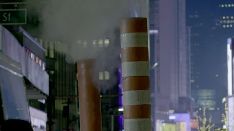 NYC  steam stack in  busy roadway. Stock Footage 257479232