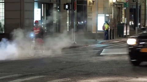 NYC streets, utility workers, steam, cars traffic, bitter cold.6 Stock Footage 220728013