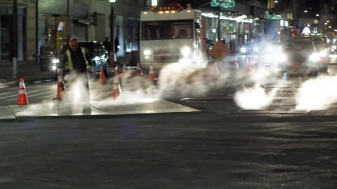 NYC streets, utility workers, steam, cars traffic, bitter cold.8 Stock Footage 220728245