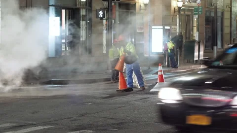 NYC streets, utility workers, steam, cars traffic, bitter cold.11 Stock Footage 220728372