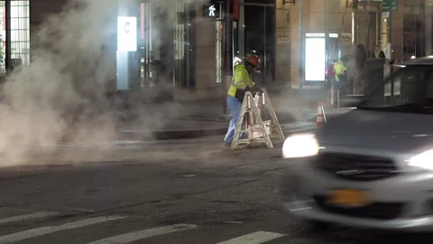  NYC streets, utility workers, steam, cars traffic, bitter cold.10 Stock Footage 220728470