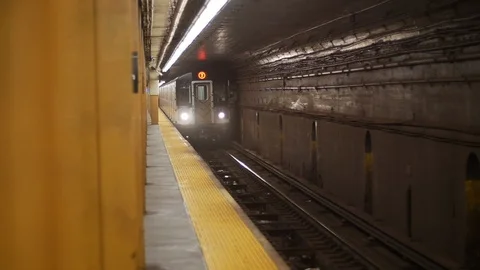 NYC subway train arrives Stock Footage 122389101