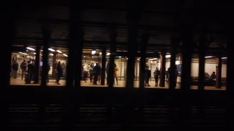 NYC Subway train driving through station Stock Footage 100464098
