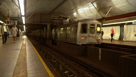 NYC subway train leaving train station with passengers - 4K Stock Video Stock Footage