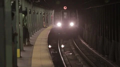 NYC subway train pulls in and leaves station Stock Footage 40521199