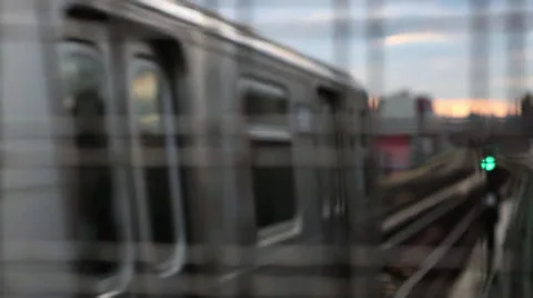 NYC Subway Train pulls out of station rack focus Stock Footage