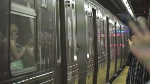NYC subway train pulls into platform, waiting a train 4K 스톡 동영상 162908740
