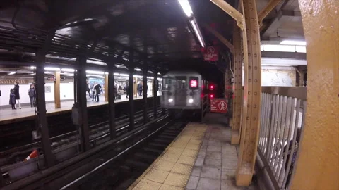 NYC subway train pulls into the station Video stock 318682157
