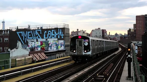 NYC subway train rolls past Stock Footage 23953716