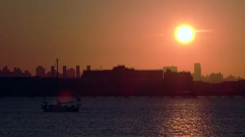 NYC Sunset plan flyby over marina water near laguardia airport 1 Stock Footage 46027961