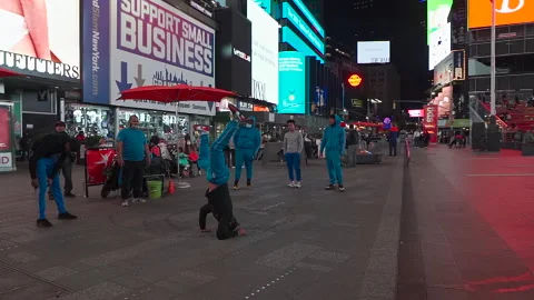 NYC Time Square Breakdancing on Street with Lights and Covid Masks Stock Footage 154747869