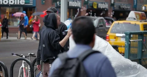 NYC Union square man with bubles 24P 4K Stock Footage 40582509