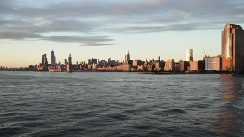 NYC view of Manhattan at sunset from the ferry. Golden sunset. Stock Footage 138587466