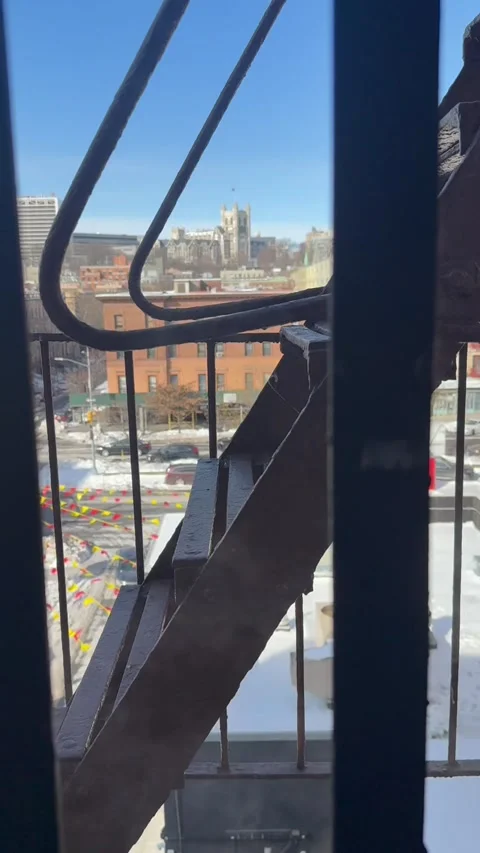 NYC Winter Harlem Fire Escape with Steam and Cathedral View Stock Footage 328039192