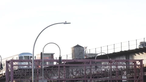 NYC's Z train passes above Williamsburg Brooklyn. Stock Footage 70236644