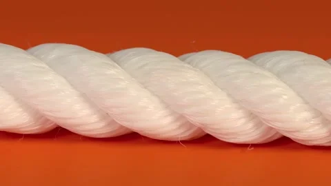 Nylon rope on orange background Stock Footage 170867933