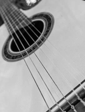 Nylon string guitar viewed from below black and white Stock Photos
