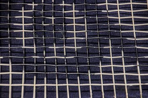 Nylon strings of a tennis racket close-up Photos