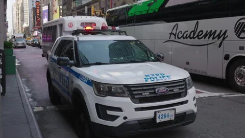 NYPD Car Parked at Times Square Police Department During Morning Commute with Stock Footage 341346722