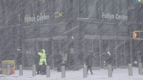 NYPD Gives Directions Outside Fulton Center in Winter Stock Footage