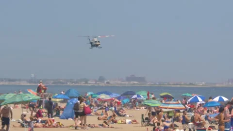 NYPD Helicopter Fly Low Over Rockaway Beach Queens Coastline Stock Footage 246750910