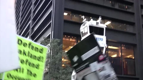 NYPD Watch Tower Looks Over Occupy Wall Street Protesters in Zuccotti Park Stock Footage 149277557