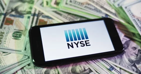 NYSE Logo on iphone surrounded by $100 Bills. NYSE Profits Layout. Stock Footage 169008001